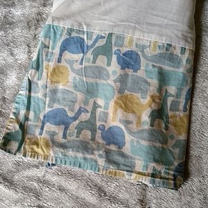 Crib bed skirt with animal print